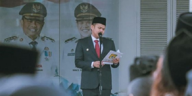 Upacara Harkitnas ke-118 di halaman Kantor Bupati Serdang Bedagai saat hujan gerimis