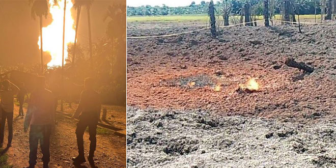 Warga berjaga dekat lokasi semburan gas dan kobaran api di Blang Rubek, Lhoksukon