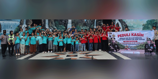 Kapolres bersama anak panti asuhan Elim saat kunjungan di Taman Hewan Siantar