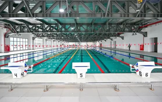Ilustrasi rancangan Paralympic Training Center dengan kolam renang, arena olahraga, dan asrama atlet