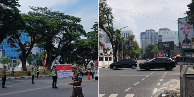 Kendaraan dan warga melintas saat sirene detik-detik Proklamasi di Medan