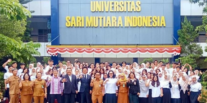 Peresmian Our Blooming Academy Medan di Kampus USM Indonesia dengan pengguntingan pita dan potong tumpeng